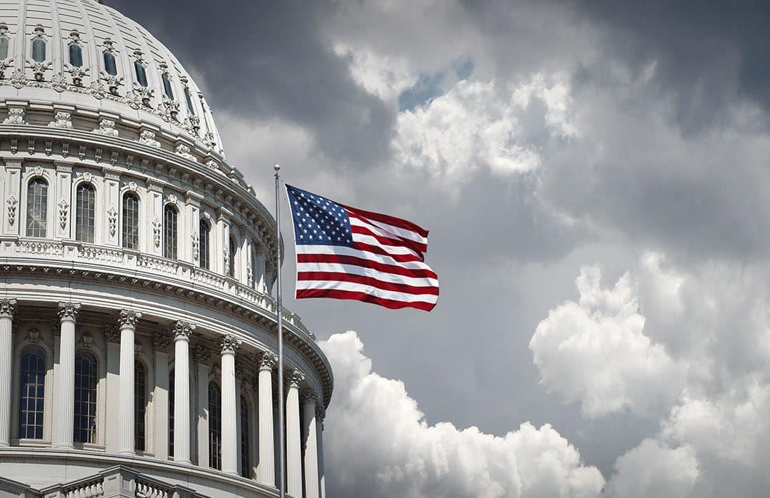 US Capitol and waving american flag